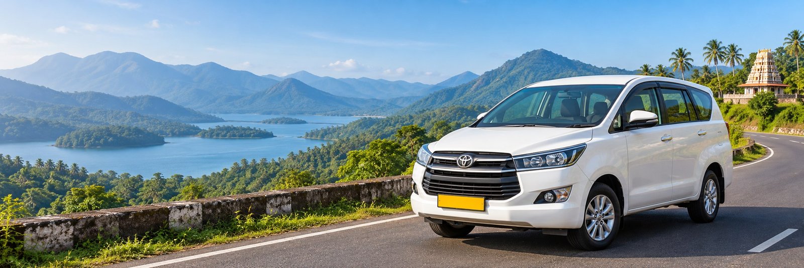 White outstation SUV on a scenic South Indian road beside a lake and green hills